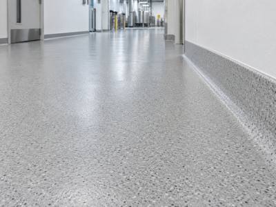Coved floor detail running up to the wall in an Ingersoll processing room