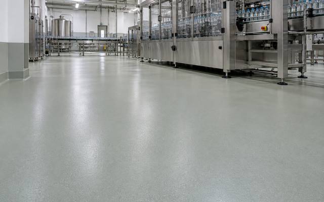 Urethane cement flooring under a stainless steel bottling line in an Oxford County beverage plant